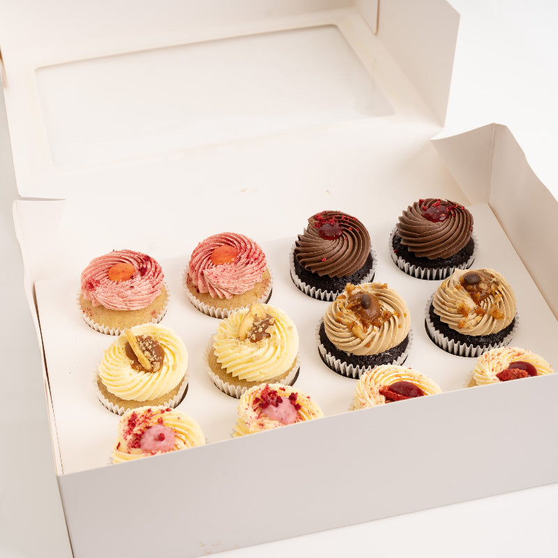 Assorted cupcake selection box featuring six handcrafted flavours.