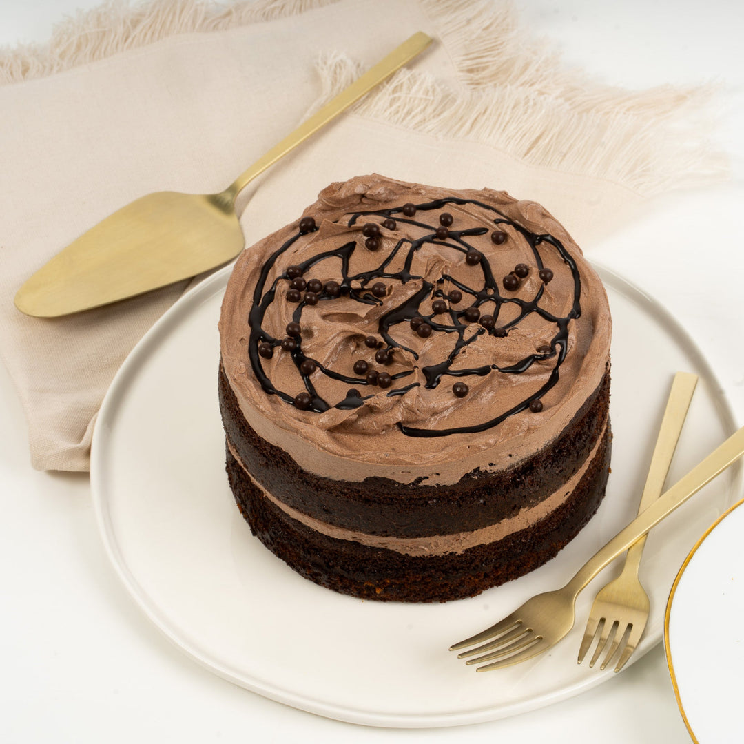 Moist chocolate cake layered with smooth buttercream, available for same day delivery.
