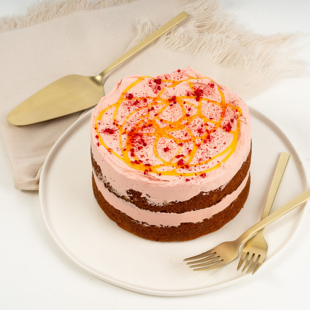 Lemon and raspberry cake with soft citrus sponge and bursts of real raspberries.