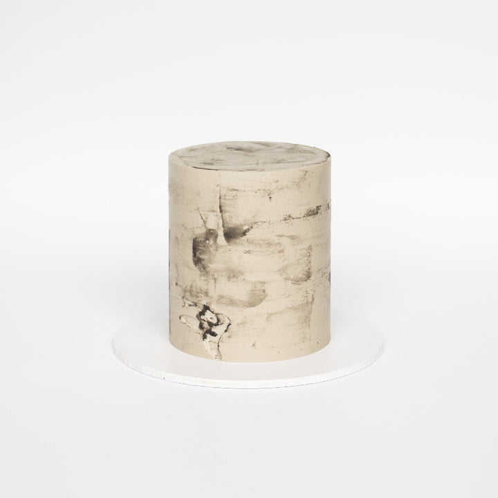 Minimalist buttercream cake ready to decorate for birthdays or weddings.