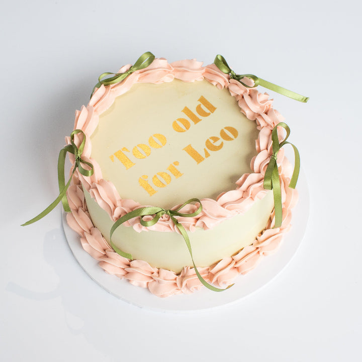 Customisable vintage cake featuring gold stencil message.