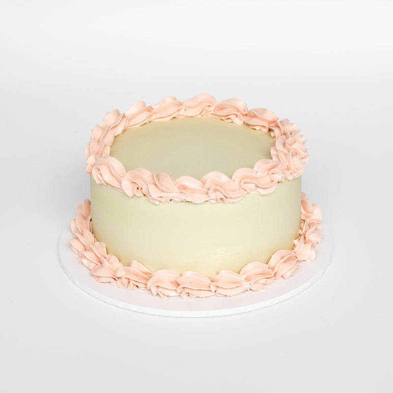 vintage cake with decorative borders and retro-style design.