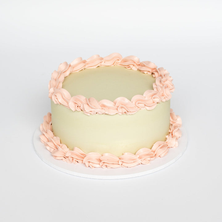 vintage cake with decorative borders and retro-style design.