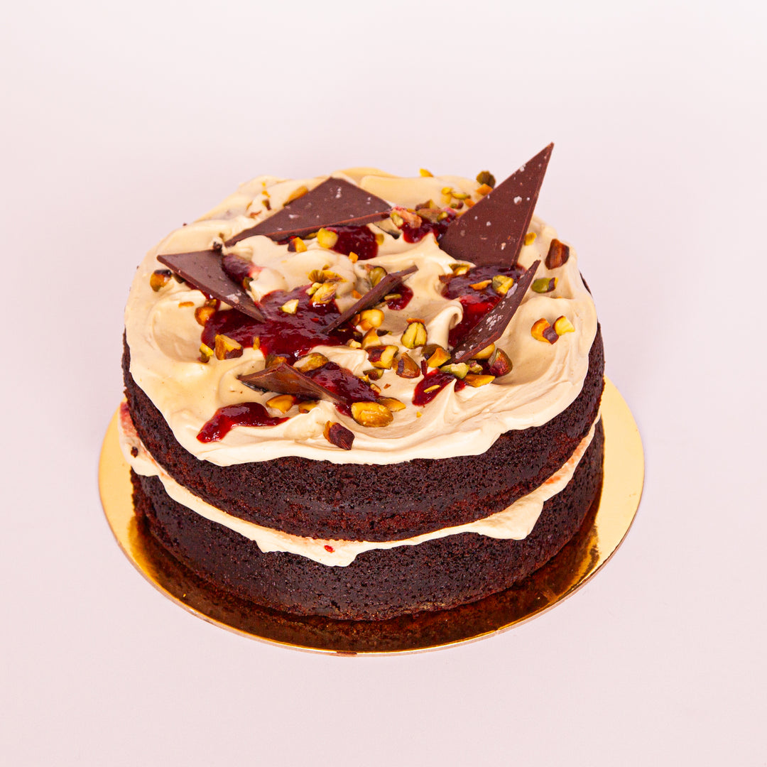 Chocolate & pistachio cake with buttercream and raspberry filling – Sweet Talk Auckland