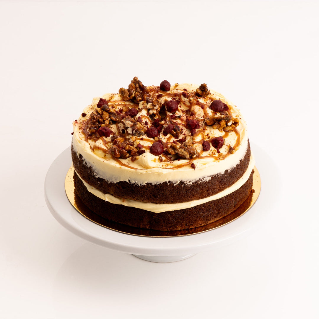 Carrot cake layered with cream cheese icing and spiced caramel sauce.