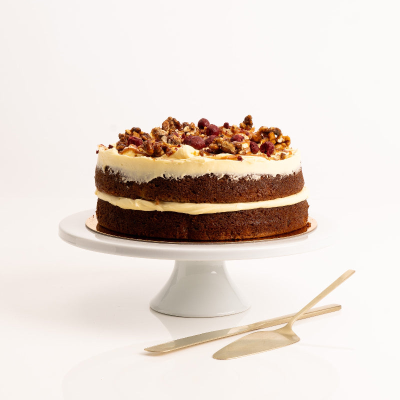 Moist carrot cake with cinnamon and nutmeg topped with caramel glaze.