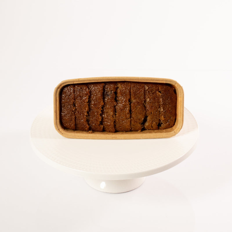 Moist spiced carrot loaf cake with cinnamon and nutmeg.