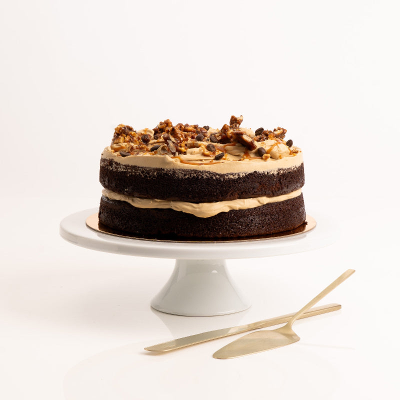 Close-up of espresso chocolate cake with salted caramel drizzle.