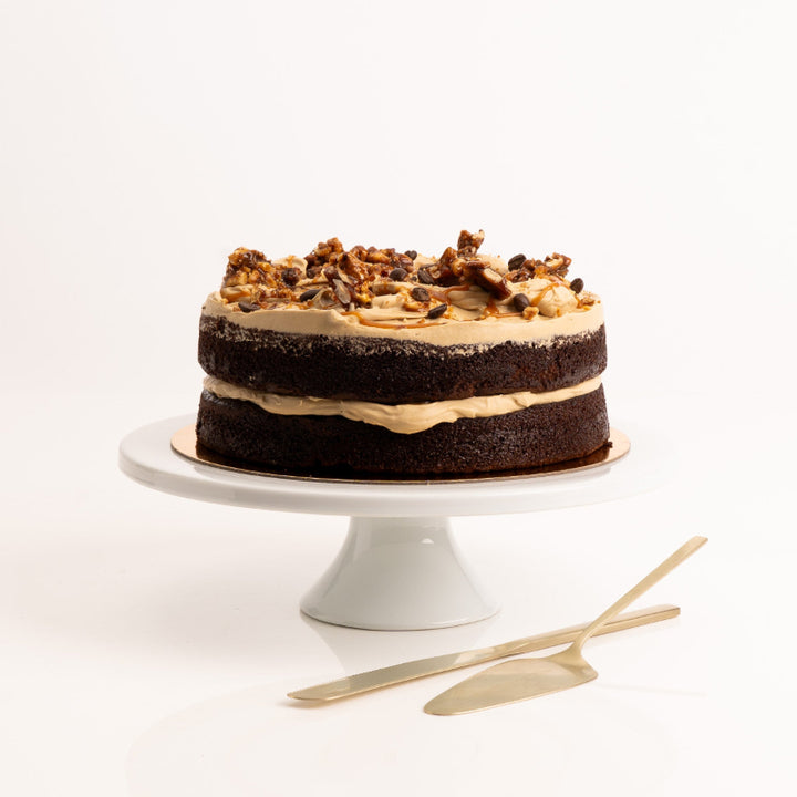Close-up of espresso chocolate cake with salted caramel drizzle.