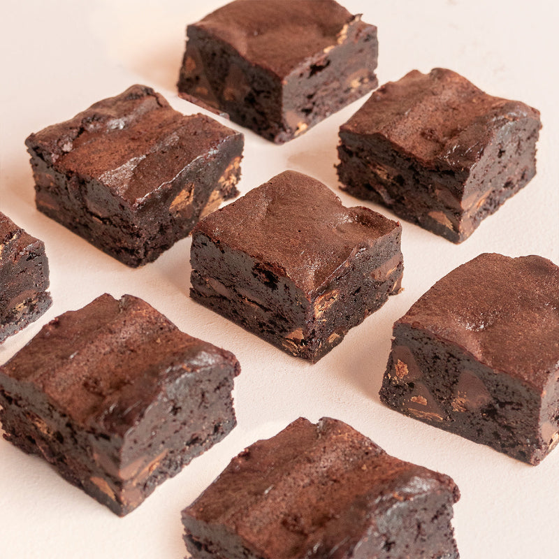 Rich chocolate brownie square with glossy ganache finish.