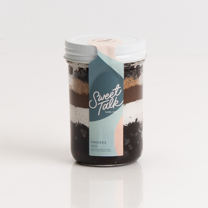 Chocolate and marshmallow S’mores dessert in a cake jar.