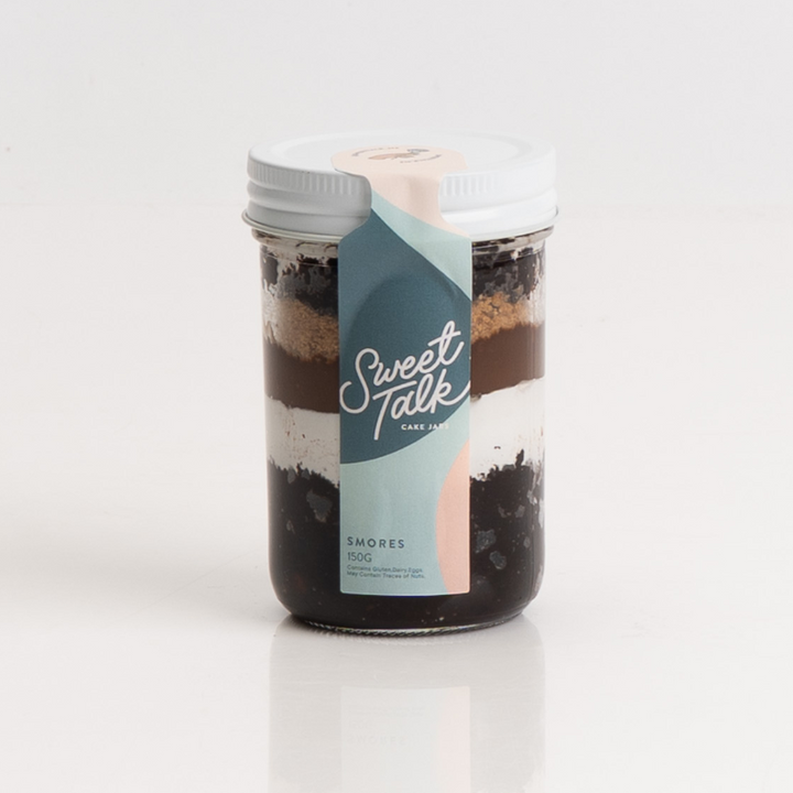 Chocolate and marshmallow S’mores dessert in a cake jar.