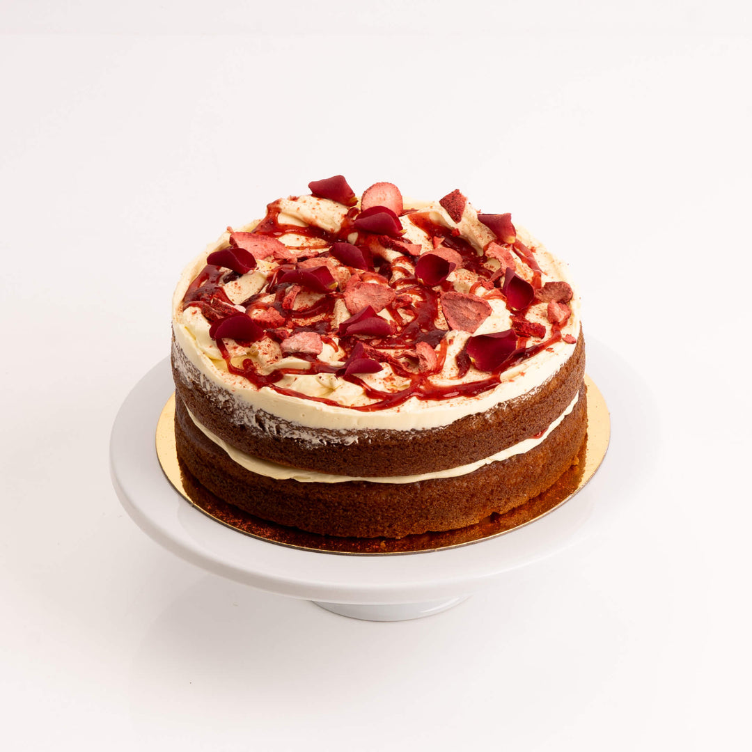 Strawberry cake layered with soft sponge and creamy white chocolate ganache.