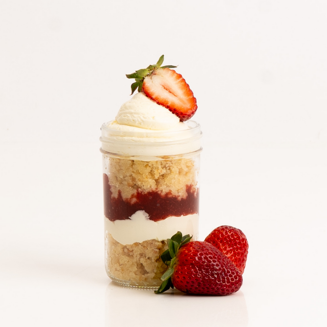 Strawberry White & Chocolate Cake Jar with mousse and sponge layers.”
