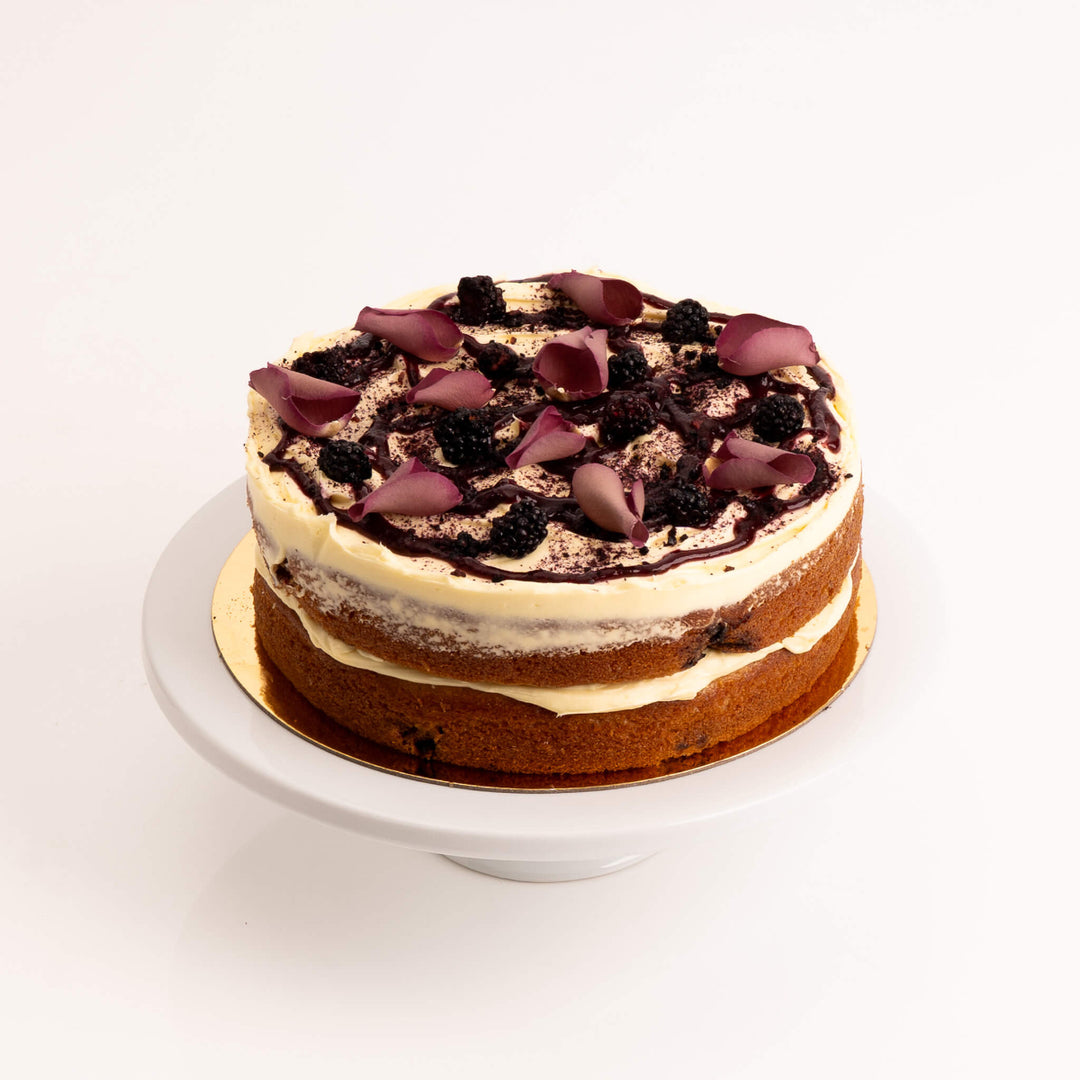 anilla and blackberry cake layered with buttercream and berry compote.