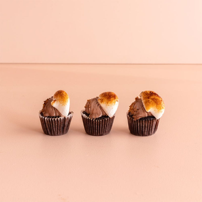 Bite-sized cupcakes topped with buttercream, available in assorted flavours