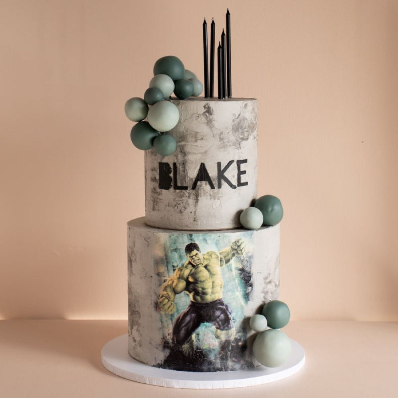 Birthday cake featuring edible photo image and chocolate bubble garland.